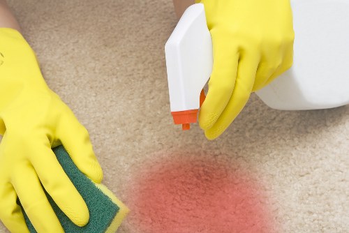 Office cleaner maintaining a professional workspace in Islington