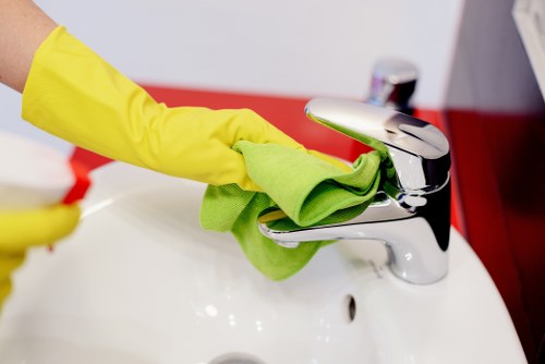 Cleaner performing regular cleaning in an Islington home with everyday upkeep focus