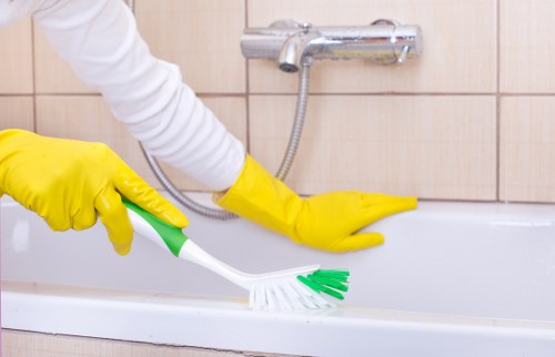 Trained carpet cleaning technician applying careful treatment in Islington