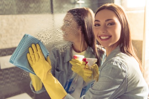 Local window cleaner working on a flat in Islington