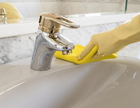 Local cleaner working in a modern Islington home kitchen